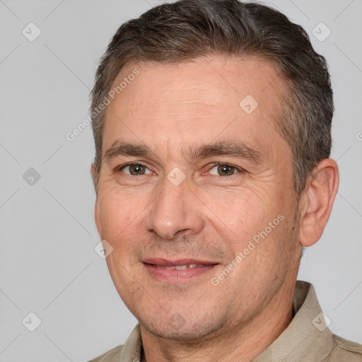 Joyful white adult male with short  brown hair and brown eyes