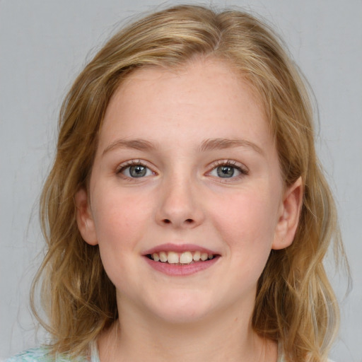 Joyful white young-adult female with medium  brown hair and blue eyes