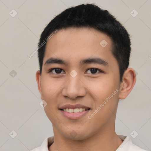 Joyful latino young-adult male with short  black hair and brown eyes