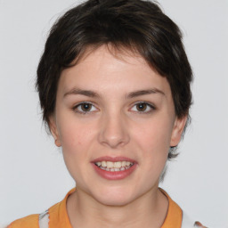 Joyful white young-adult female with medium  brown hair and brown eyes