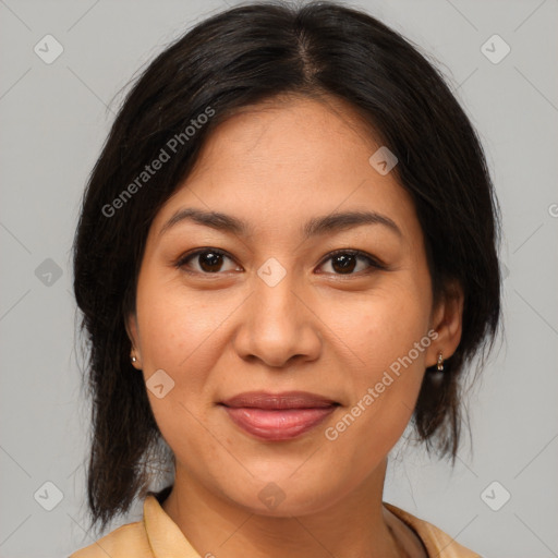 Joyful latino young-adult female with medium  brown hair and brown eyes