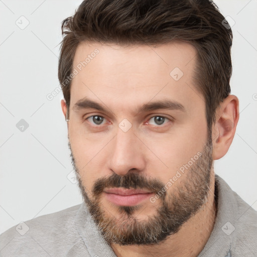 Neutral white young-adult male with short  brown hair and brown eyes