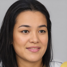 Joyful asian young-adult female with long  brown hair and brown eyes