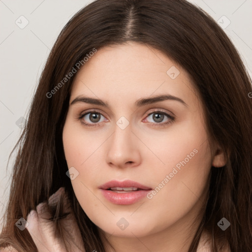 Neutral white young-adult female with long  brown hair and brown eyes