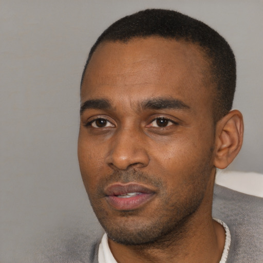 Neutral black young-adult male with short  black hair and brown eyes