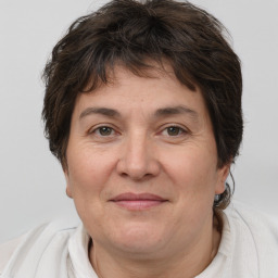 Joyful white adult female with short  brown hair and brown eyes