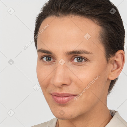 Joyful white young-adult female with short  brown hair and brown eyes