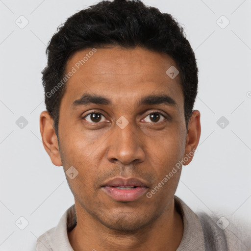 Joyful latino young-adult male with short  black hair and brown eyes