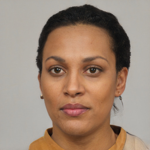 Neutral latino adult female with short  black hair and brown eyes
