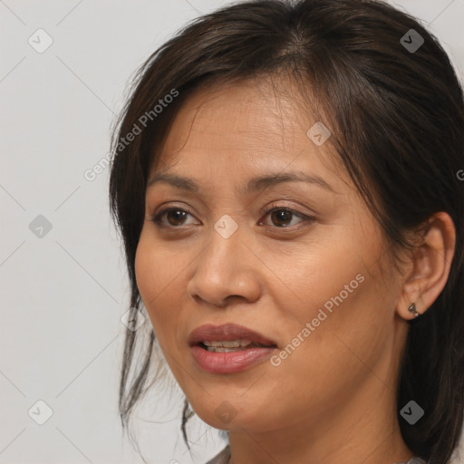 Joyful white adult female with medium  brown hair and brown eyes