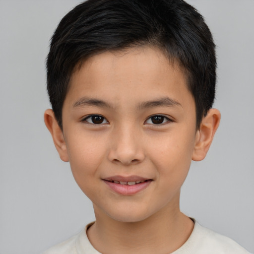 Joyful asian child female with short  brown hair and brown eyes