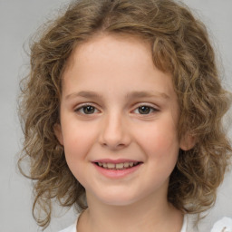 Joyful white child female with medium  brown hair and brown eyes