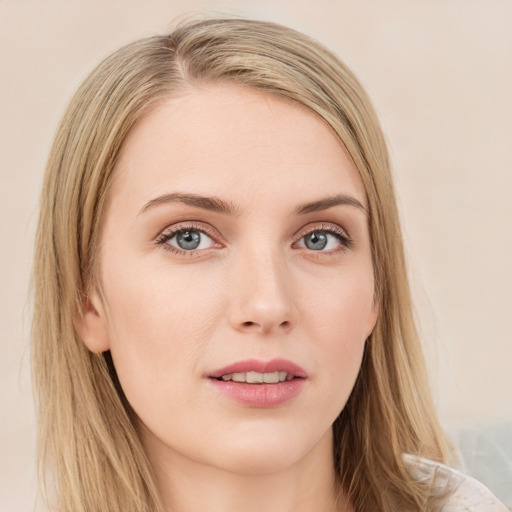 Joyful white young-adult female with long  brown hair and blue eyes