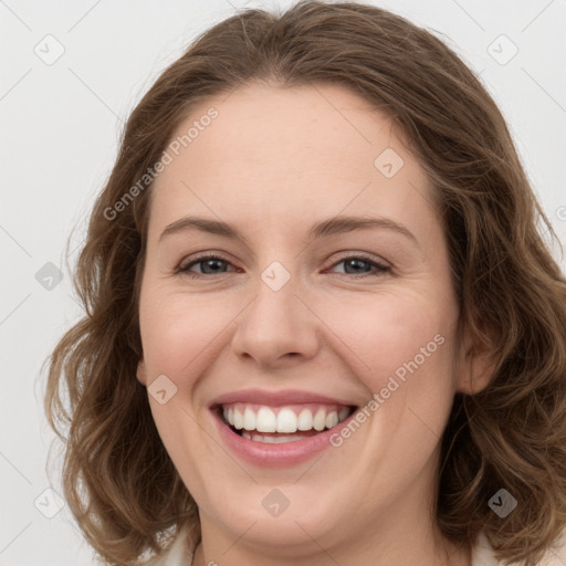 Joyful white young-adult female with medium  brown hair and green eyes