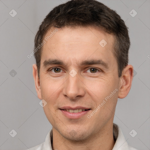 Joyful white adult male with short  brown hair and brown eyes