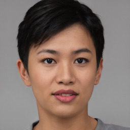 Joyful asian young-adult female with short  black hair and brown eyes