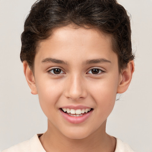 Joyful white child male with short  brown hair and brown eyes