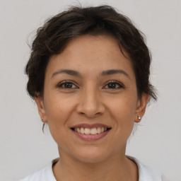 Joyful asian young-adult female with short  brown hair and brown eyes