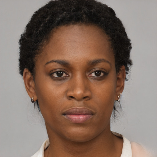 Neutral black young-adult female with short  brown hair and brown eyes