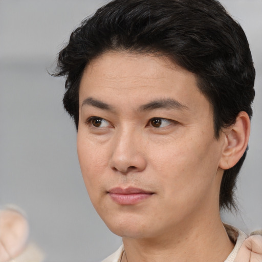 Joyful white adult male with medium  brown hair and brown eyes