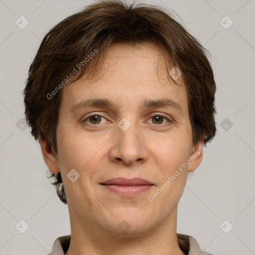 Joyful white adult male with short  brown hair and grey eyes