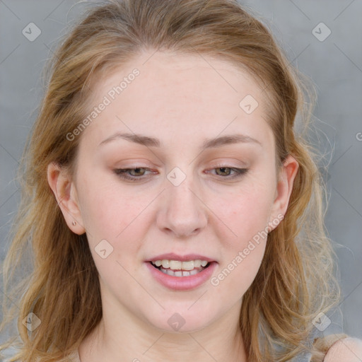 Joyful white young-adult female with medium  brown hair and blue eyes