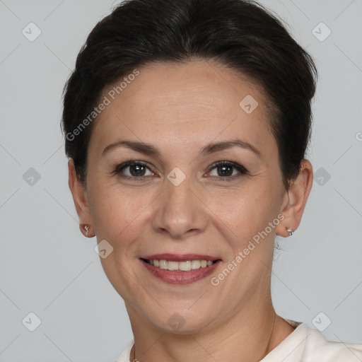 Joyful white adult female with short  brown hair and brown eyes