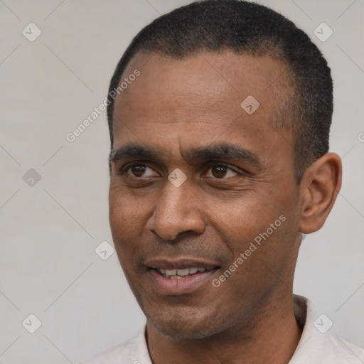 Joyful latino adult male with short  black hair and brown eyes