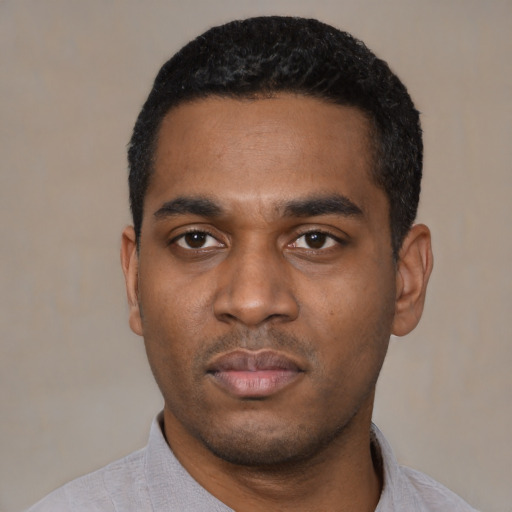 Neutral latino young-adult male with short  black hair and brown eyes