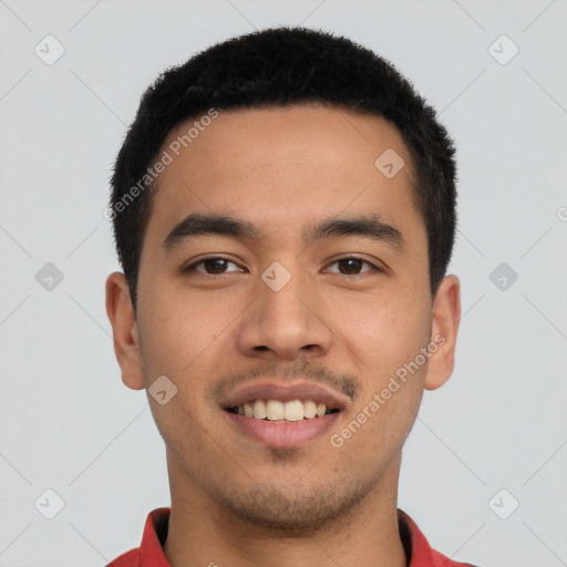 Joyful latino young-adult male with short  black hair and brown eyes