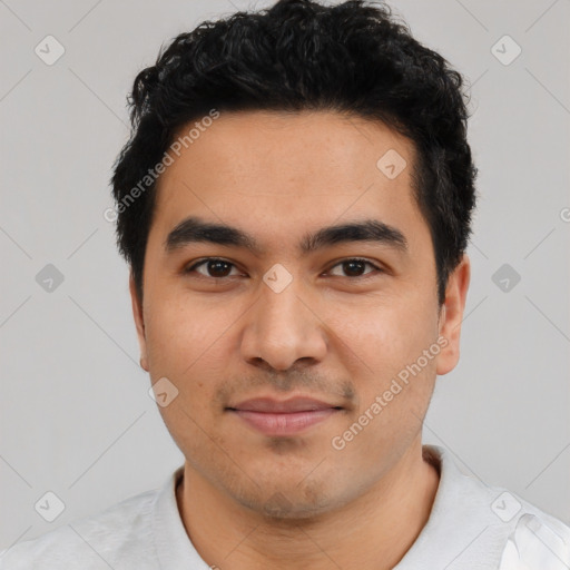 Joyful latino young-adult male with short  black hair and brown eyes