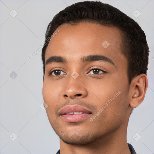 Joyful white young-adult male with short  black hair and brown eyes