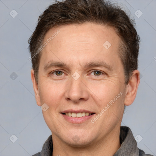 Joyful white adult male with short  brown hair and grey eyes