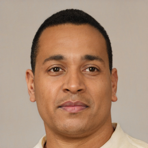 Neutral latino young-adult male with short  brown hair and brown eyes