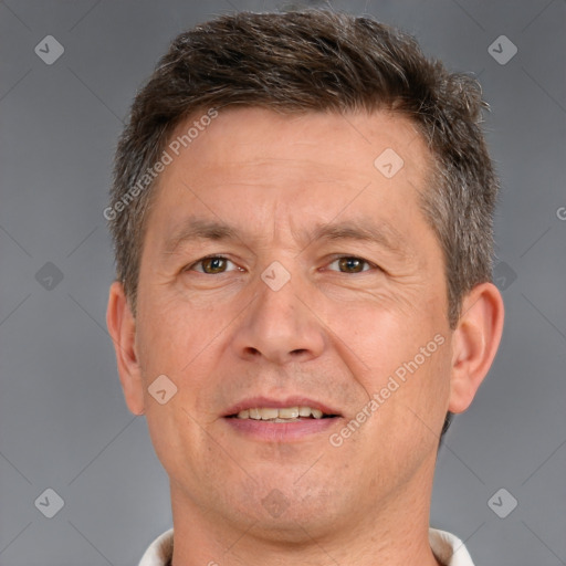 Joyful white adult male with short  brown hair and brown eyes