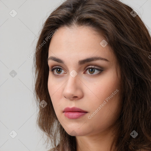 Neutral white young-adult female with long  brown hair and brown eyes