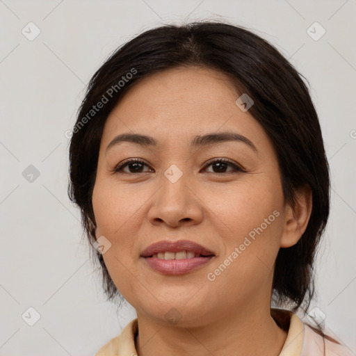 Joyful white adult female with medium  brown hair and brown eyes