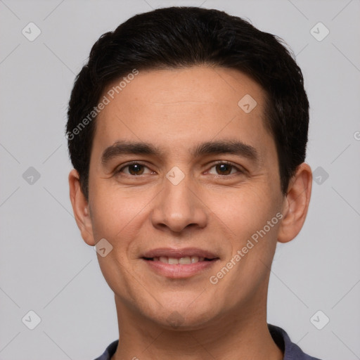 Joyful white young-adult male with short  black hair and brown eyes