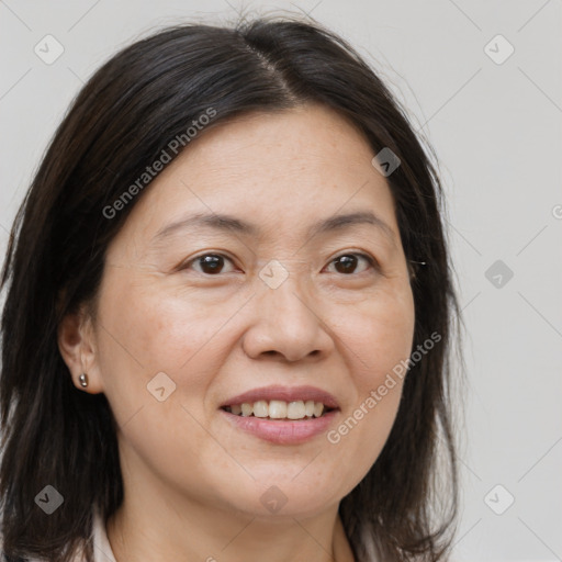 Joyful white adult female with medium  brown hair and brown eyes