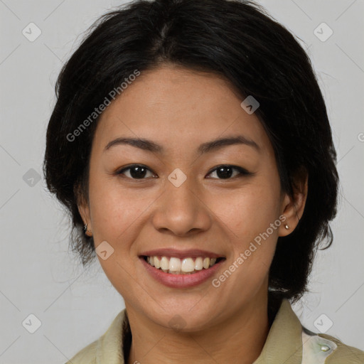 Joyful latino young-adult female with medium  brown hair and brown eyes