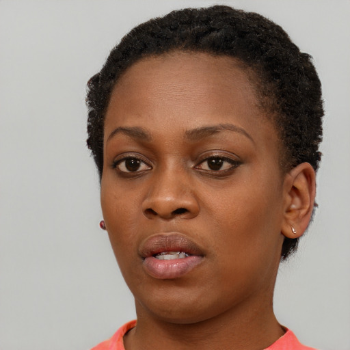 Neutral black young-adult female with short  black hair and brown eyes