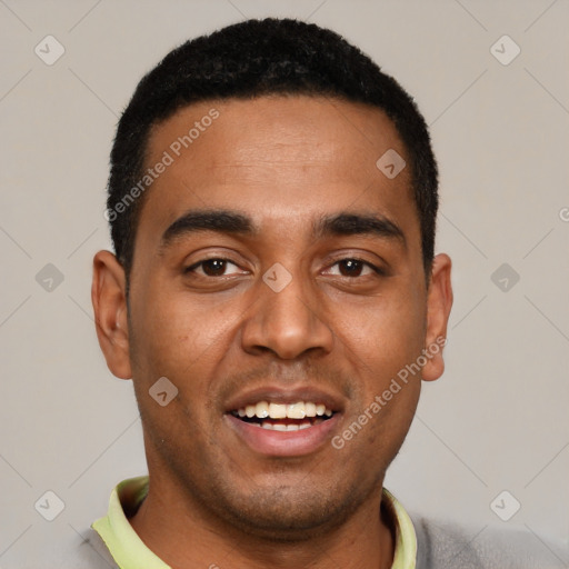 Joyful black young-adult male with short  black hair and brown eyes