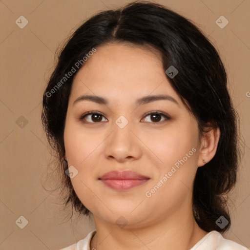 Joyful latino young-adult female with medium  brown hair and brown eyes