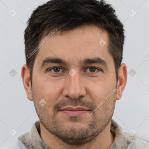 Joyful white adult male with short  brown hair and brown eyes