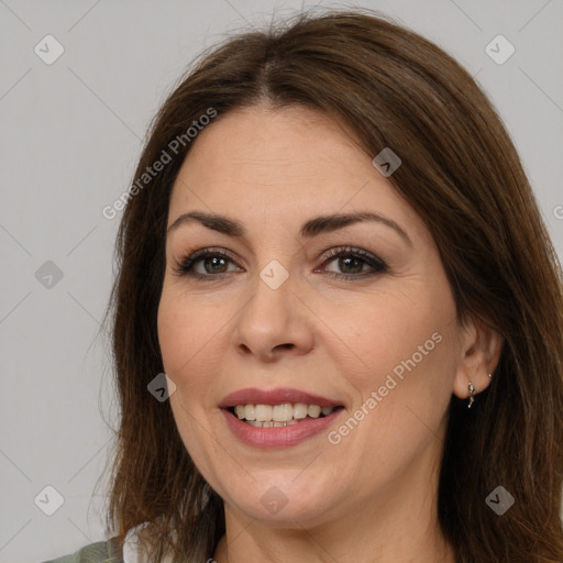 Joyful white adult female with medium  brown hair and brown eyes