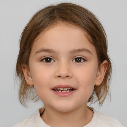 Joyful white child female with medium  brown hair and brown eyes