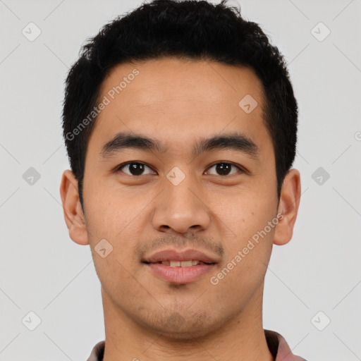 Joyful latino young-adult male with short  black hair and brown eyes