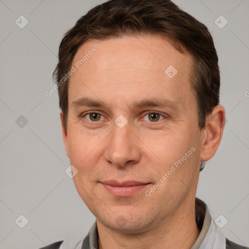 Joyful white adult male with short  brown hair and brown eyes