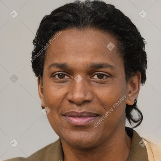 Joyful black adult male with short  black hair and brown eyes