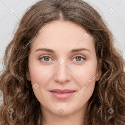 Joyful white young-adult female with long  brown hair and green eyes